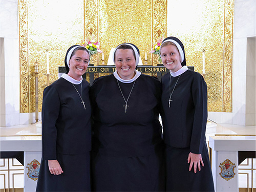 Three sisters posing for a picture together