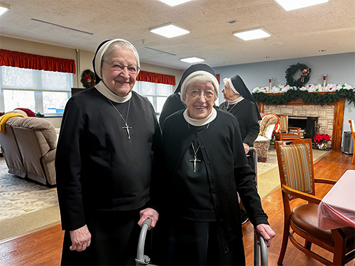 Two sisters smiling for the camera